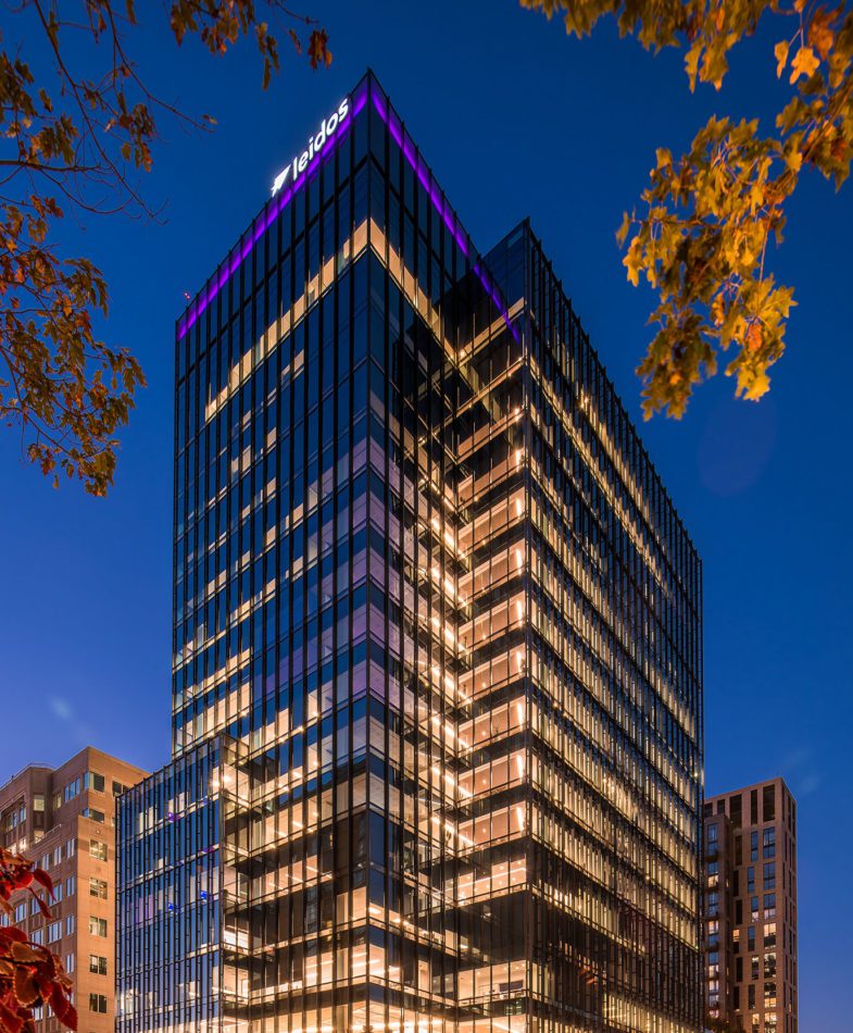 Night time image of Leidos HQ at 1750 Presidents St