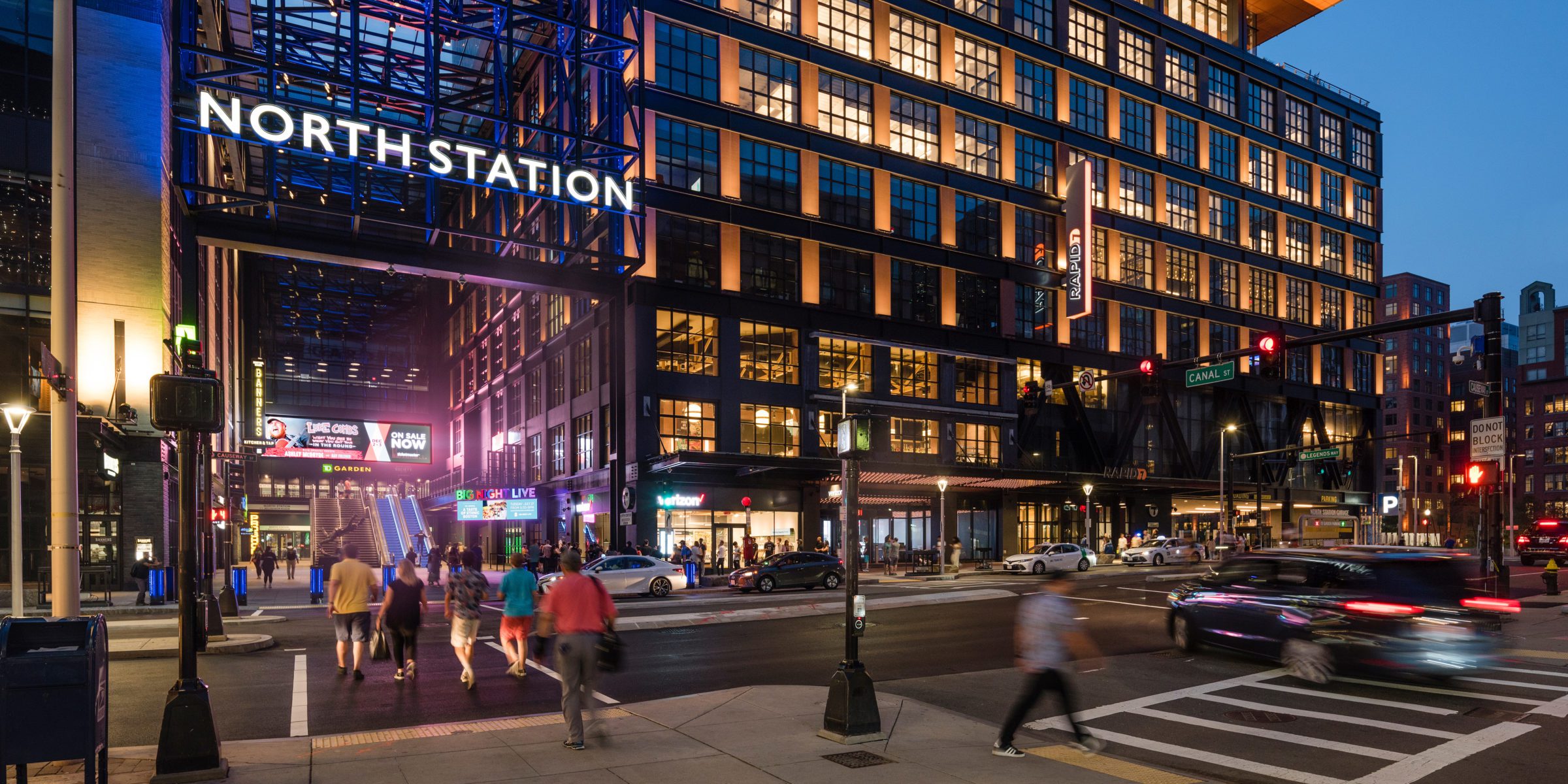 Street Level of the Hub on Causeway bustling at night.