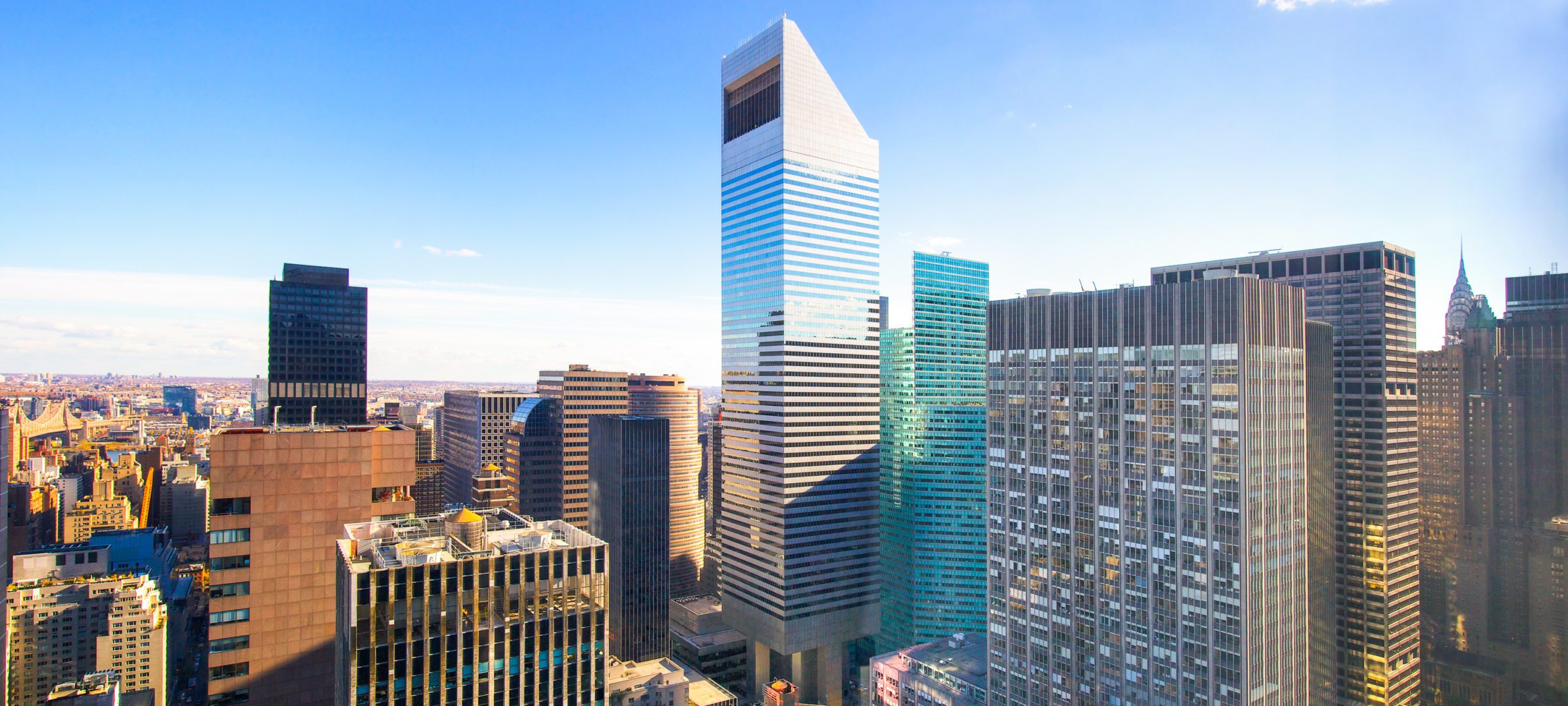 601 Lexington towering over Manhattan on bright sunny morning.