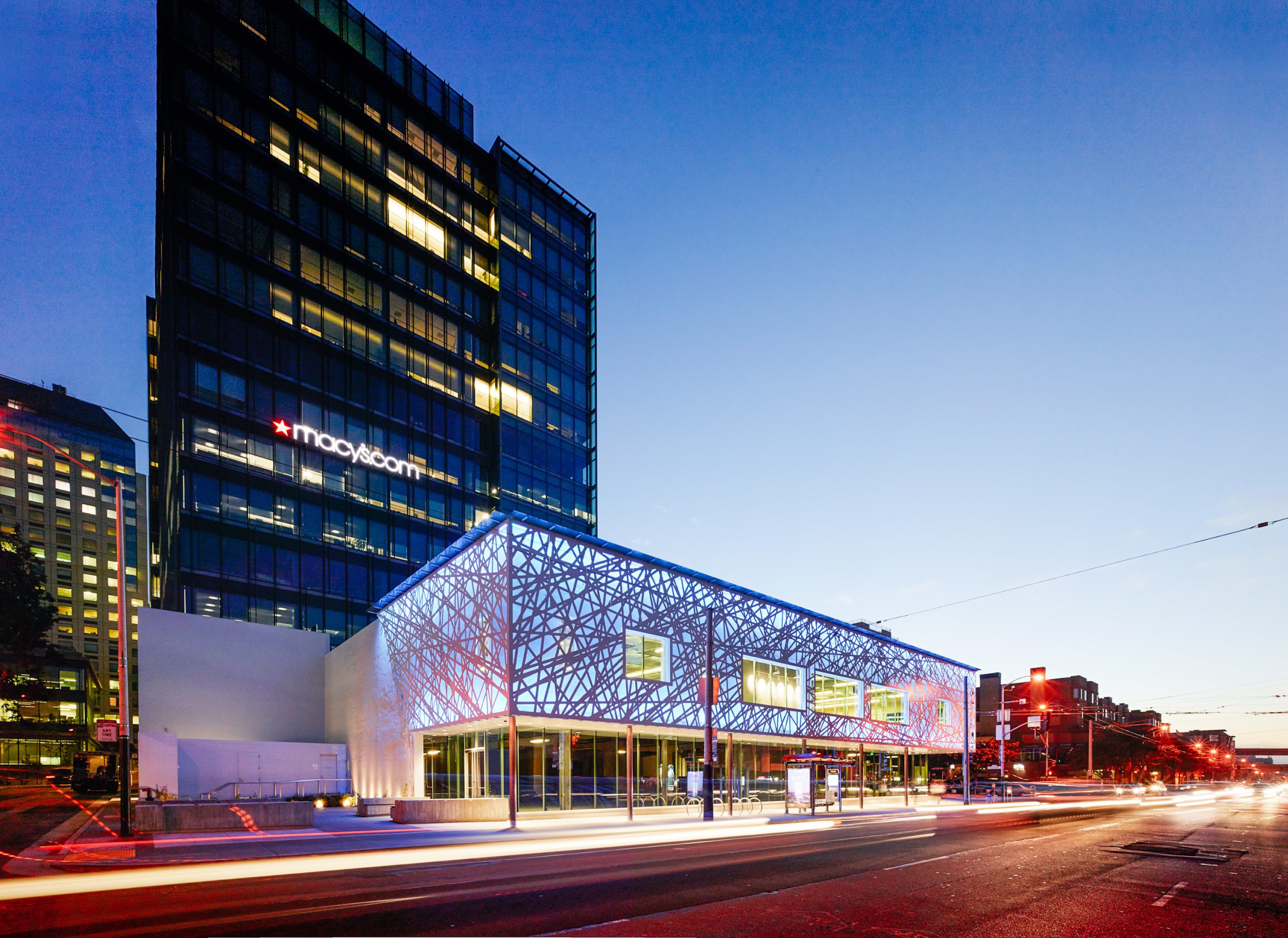 Corner Facade of 680, 690 Folsom and 50 Hawthorne at night.