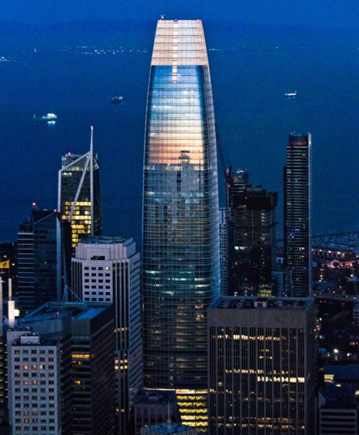 Salesforce tower at night with the sunset reflection.