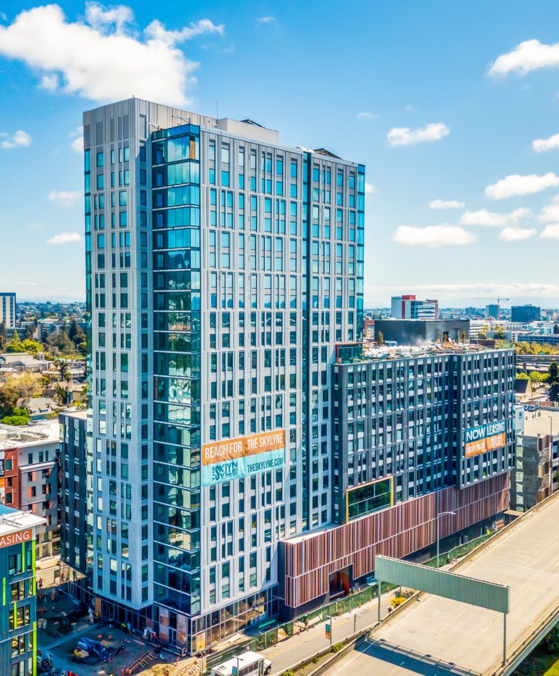 Exterior facade of Skylyne at Temescal on a sunny day.