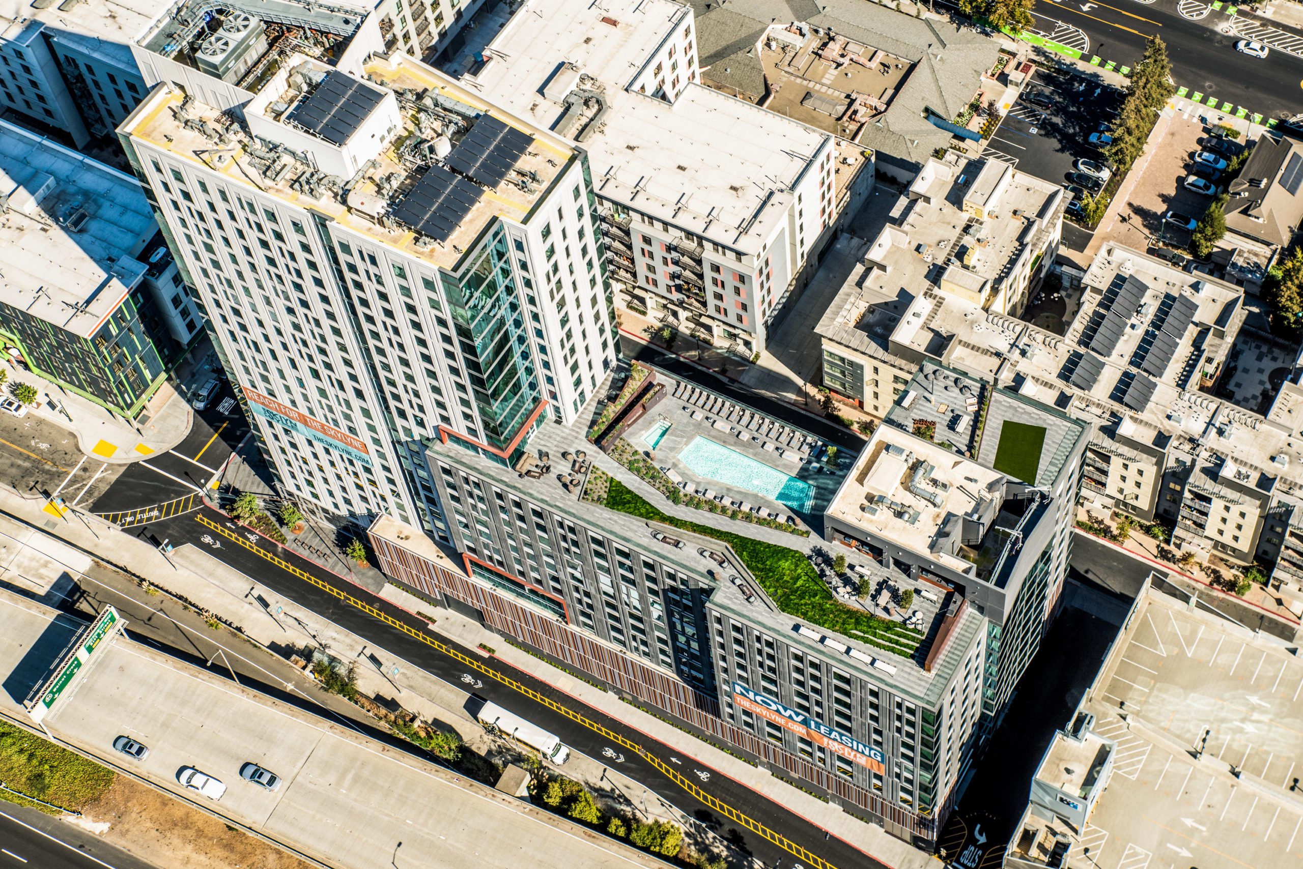 Bird's Eye View of Skylyne at Temescal featuring the rooftop pool and greenspace.