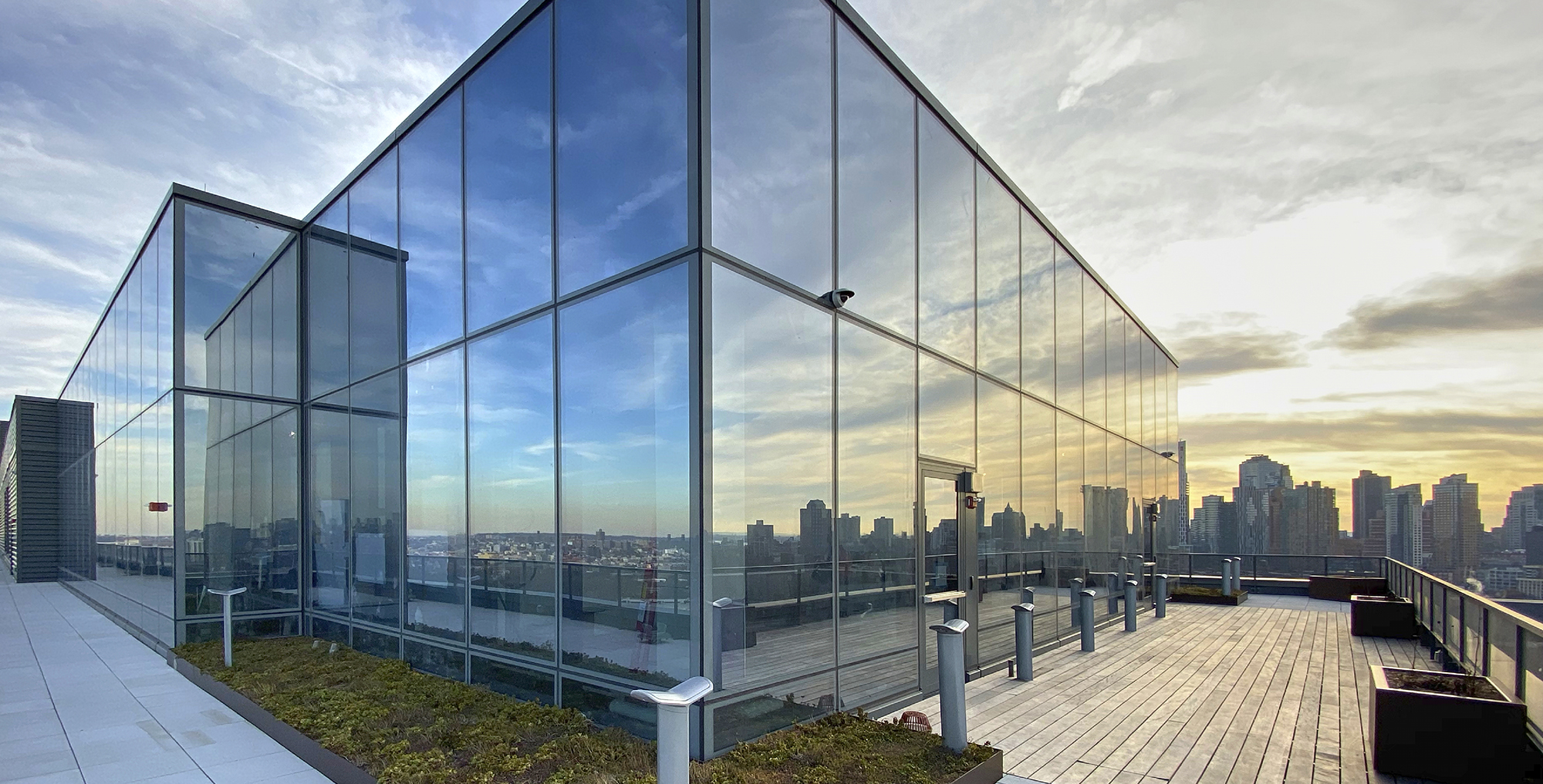 Reflection of New York City in Dock 72 windows.