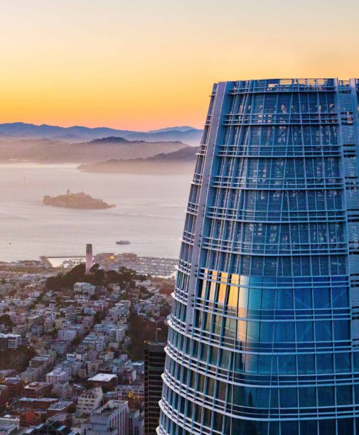Salesforce Tower overlooking San Francisco at sunset.