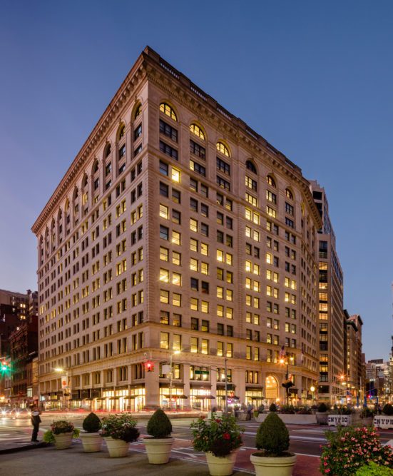 Night time image of 200 Fifth Avenue in Midtown South