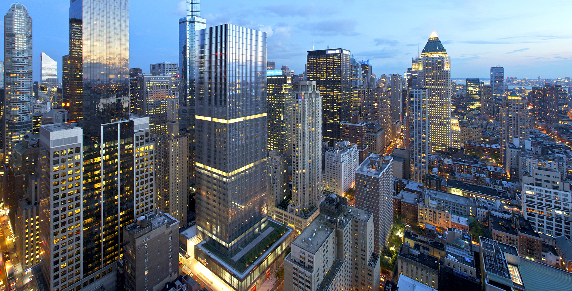 Reflection of sunset in 250 West 55th Street windows.